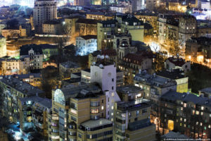 A nighttime birds-eye view of buildings in Kiev.